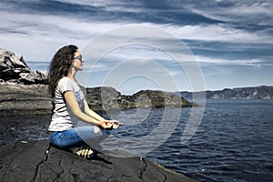 Young woman is enjoying the sunny day on the seaside