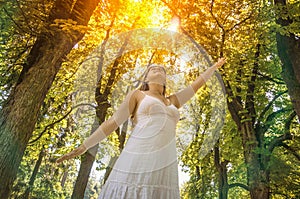 Young woman enjoying the sunshine on a sunny day