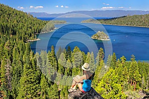 Young woman enjoying the view of Emerald Bay at Lake Tahoe, Cali