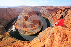 Young woman enjoying view of Horseshoe bend, Arizona, USA