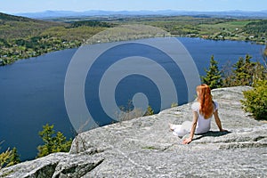 Young woman enjoying the view over lake