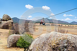 The young woman is enjoying the zip line in the Piedrotas de Tapalpa in Jalisco. photo