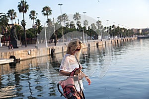 Young woman enjoys the evening in Barcelona