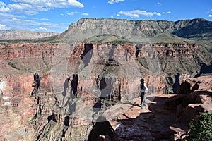 Young woman at Toroweap Overlook in the Grand Canyon. photo