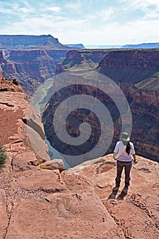 Young woman at Toroweap Overlook in the Grand Canyon. photo