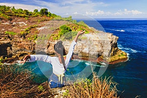 Young woman enjoys spectacular view tropical island nature