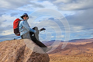 Young woman enjoys stunning views of Icelandic landscape