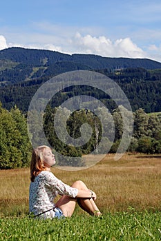 A young woman enjoys the summer photo
