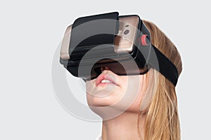 Young woman entertaining with VR-Helmet