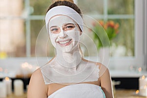 Young woman at enzymatic peeling therapy in spa photo