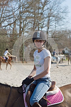 Young Woman Equestrian Training