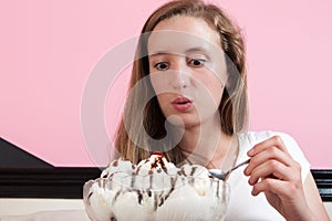 Young woman excited about giant ice cream sundae