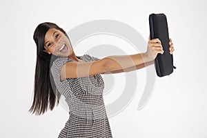 Young Woman Excitedly Holding Out a Laptop Case