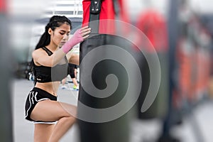 Young woman execute exercise in fitness center. female athlete h