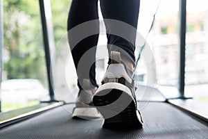 Young woman execute exercise in fitness center. female athlete w