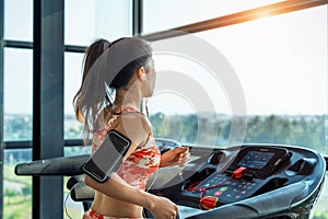 Young woman exercise with exercise-machine in gym