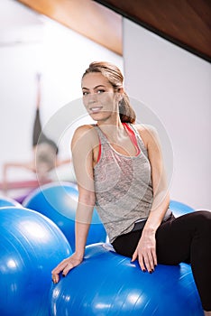 Young woman exercise with pilates balls