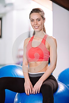 Young woman exercise with pilates balls