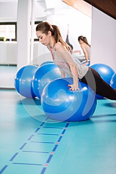 Young woman exercise with pilates balls