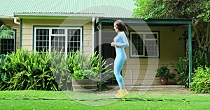 Young Woman Exercise using Agility Ladder. Pretty woman is stepping up