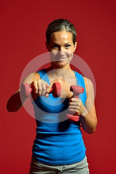 Young woman exercising in the gym