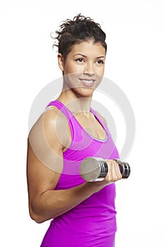 Young woman exercising holding dumbbells smiling