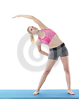 Young woman exercising on mat