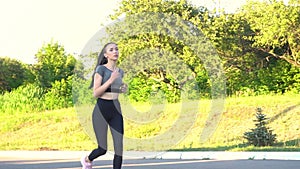 Young woman are exercising with outdoor running in the city park.