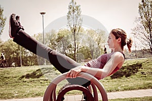 Young woman exercising outdoors.