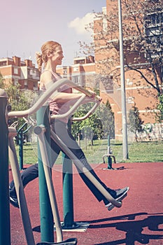 Young woman exercising outdoors.