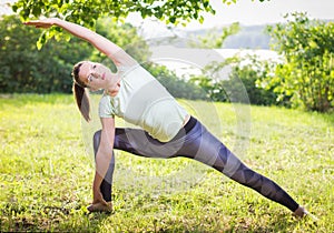 Young woman exercising outdoors in nature