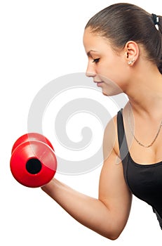 Young woman exercising with red dumbbell