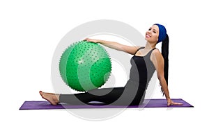 The young woman exercising with swiss ball