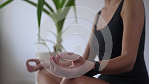 Young woman exercising on yoga mat at daytime