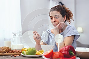 Young woman experiencing lack of appetite