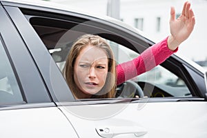 Young woman experiencing road rage