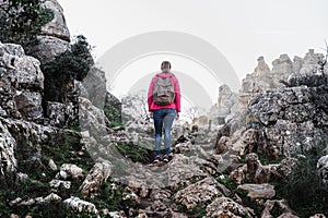 Young woman explorer walking on the mountain.