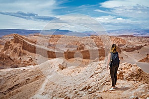 Young Woman Exploring the Moon Valley in the Atacama Desert, Chile, South America