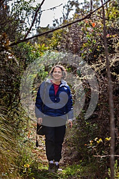 Young woman exploring the nature of a beautiful paramo at the department of Cundinamarca in Colombia photo