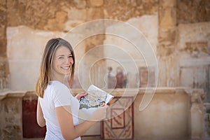 Young woman exploring the ruins of masada in israel photo