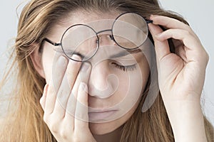 Young woman with eye fatigue