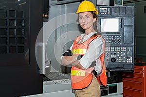 Young woman factory worker close up portrait in manufacturing job factory