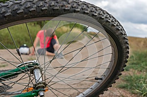 Young woman fallen from mountain bicycle