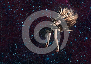 Young woman falling through space