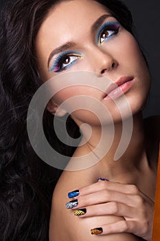 Young woman with fashion make-up and manicure