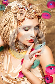 Young woman with fashion makeup on brown