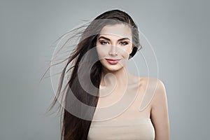 Young woman fashion model with long dark hairstyle