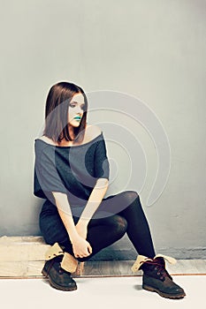 Young woman fashion portrait in shapeless dress .