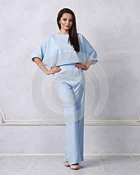 Young woman in fashionable blue jumpsuit