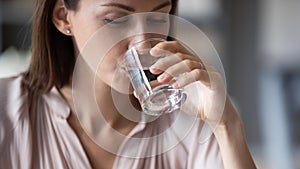 Young woman feel thirsty drink still mineral water